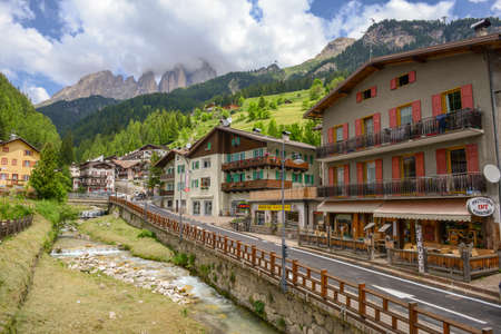 Canazei, Italy - 21 June 2018: Village of Canazei on Fassa valley in Trentino Alto Adige, Italy