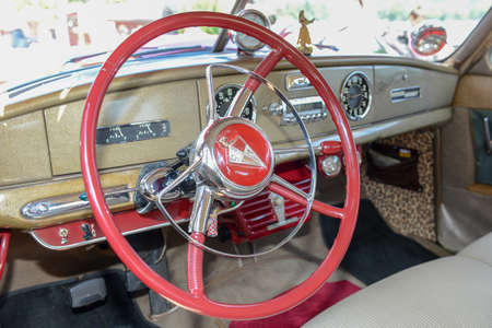 Wheel and dashboard of a vintage car