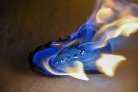 Burning old shoe at night on the Snow