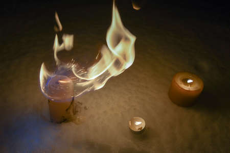 Burning candles at night on the Snow