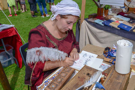 Bellinzona, Switzerland - 27 May 2018: Scribbled woman who is drawing a painting at Castelgrande castle at Bellinzona on the Swiss alpsのeditorial素材