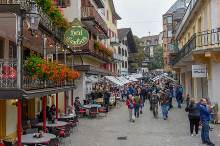Engelberg, Switzerland - 29 September 2018: People selling and buying at the market in Engelberg on...