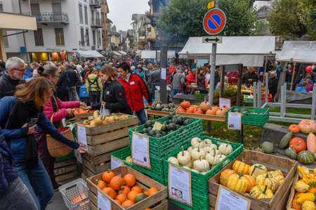 Engelberg, Switzerland - 29 September 2018: People selling and buying pumpkins at the market in Engelberg on the Swiss alpsのeditorial素材