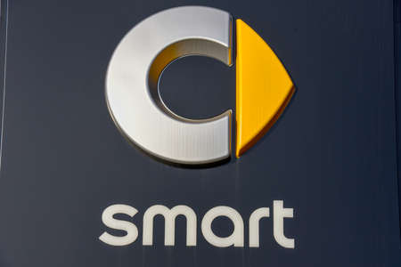 Lugano, Switzerland - 24 October 2018: Logo sign of Smart car dealer at Lugano on Switzerland