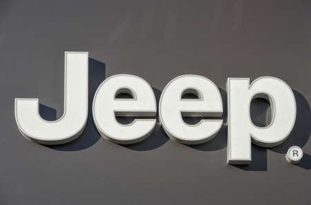 Lugano, Switzerland - 24 October 2018: Logo sign of Jeep car dealer at Lugano on Switzerland