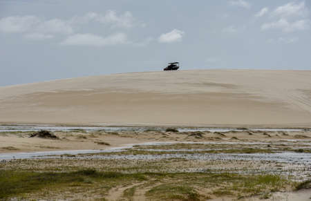 Atins, Brazil - 12 January 2019: tourist truck on the dunes at Lencois Maranhenese National Park in...
