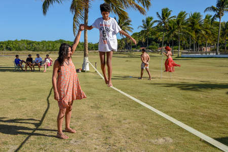 Pipa, Brazil - 23 January 2019: Woman on tightrope walker training near Pipa on Brazilのeditorial素材