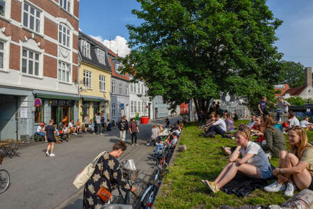 Aarhus, Denmark - 19 June 2019: people drinking on a street bar of Aarhus on Denmark