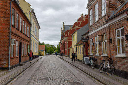 Ribe, Denmark - 22 June 2019: people walking at the traditional historic village of Ribe on Jutland...