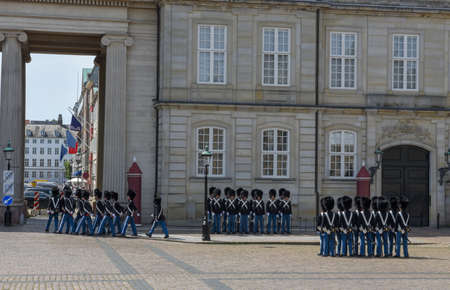 Copenhagen Denmark - 25 June 2019: changing of the guard at Amalienborg palace on town square in...