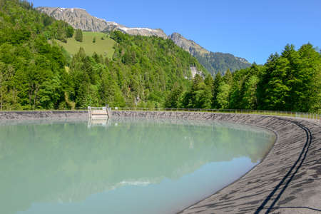 Lake dam near Engelberg in the Swiss alpsの写真素材