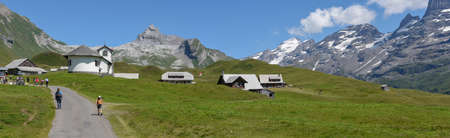 Tannen, Switzerland - 4 August 2019: people hiking at Tannen over engelberg on the Swiss alpsのeditorial素材