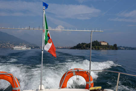 Boat leaving Madre island on lake Maggiore in Italyの写真素材