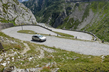 Mount Gotthard, Switzerland - 3 August 2019: Car along the old road of Mount Gotthard on the Swiss alpsのeditorial素材