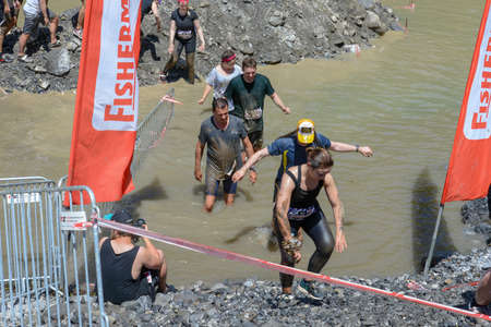 Engelberg, Switzerland - 2 June 2019: people participating at Fischerman's friend strongman run at...