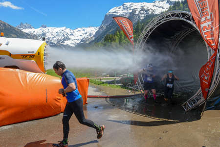 Engelberg, Switzerland - 2 June 2019: people participating at Fischerman's friend strongman run at...