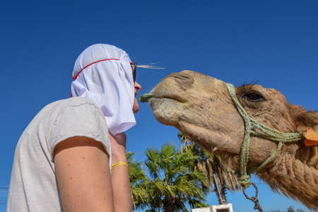 Sousse, Tunisia -  8 November 2019: tourist with a camel at Sousse in Tunisiaのeditorial素材