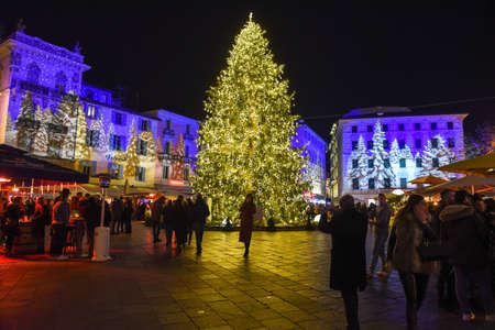 Lugano, Switzerland - 11 December 2019: people shopping on the christmas market in the central square of Lugano, Switzerlandのeditorial素材