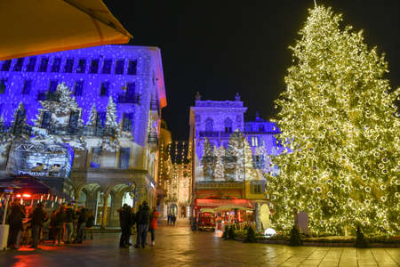 Lugano, Switzerland - 11 December 2019: people shopping on the christmas market in the central square of Lugano, Switzerlandのeditorial素材