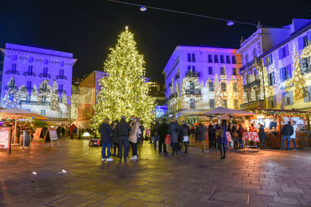 Lugano, Switzerland - 11 December 2019: people shopping on the christmas market in the central square of Lugano, Switzerlandのeditorial素材