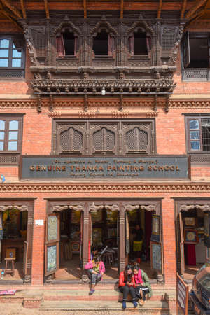 Bhaktapur, Nepal - 27 January 2020: people sitting in front of a traditional house at Bhaktapur on Nepalのeditorial素材