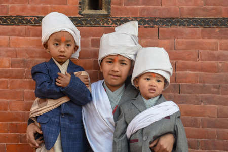 Bhaktapur, Nepal - 27 January 2020: tree children posing at Bhaktapur in Nepalのeditorial素材