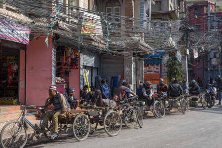 Kathmandu, Nepal - 7 January 2020:   rickshaw drivers waiting for their customers on the old center of Kathmandu in Nepalのeditorial素材