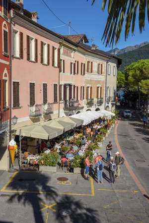 Morcote, Switzerland - 28 September 2020: people eating and drinking on street restaurants of Morcote in Switzerlandのeditorial素材