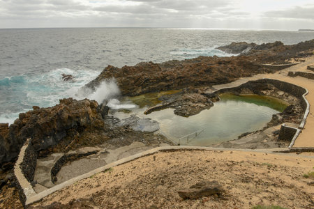 Natural swimming pool of Charco del Palo at Lanzarote on Canary islands in Spainの写真素材