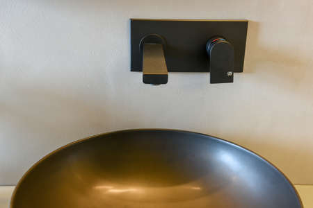 Close up of a sink on an elegant modern bathroom in a new appartmentの写真素材