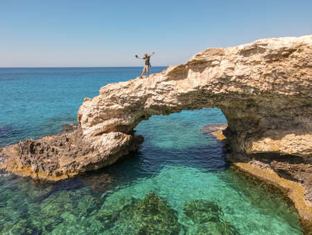 Ayia Napa, Cyprus - 12 May 2021: tourists on lover's bridge near Ayia Napa in Cyprusの写真素材