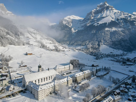 Winter landscape view at the monastery of Engelberg on the Swiss alpsの写真素材