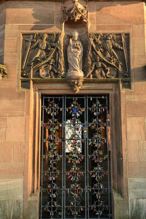 Love padlocks on the old bridge over the Rhine river in Basel on Switzerlandの写真素材