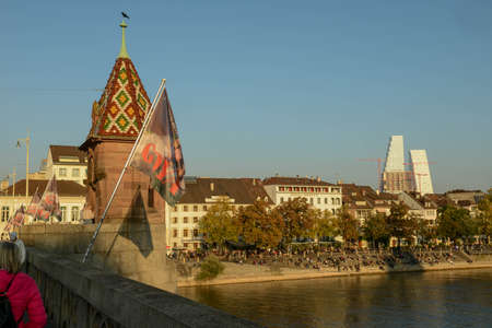 Basel, Switzerland - 17 Oktober 2021: people relaxing by the river Rhine at Basel in Switzerland