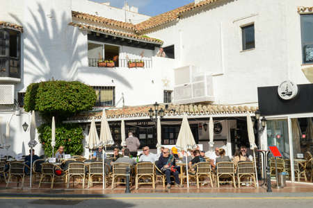 Puerto Banus, Spain - 5 January 2022: people drinking on a restaurant of Puerto Banus on Spainのeditorial素材