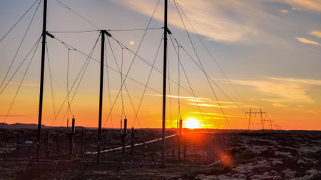 Sunset with electric pylons at blue Lagoon on Icelandの写真素材