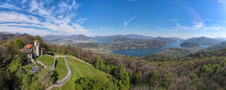 Drone view at the church of Santa Maria over Iseo on Malcantone valley in the swiss alps