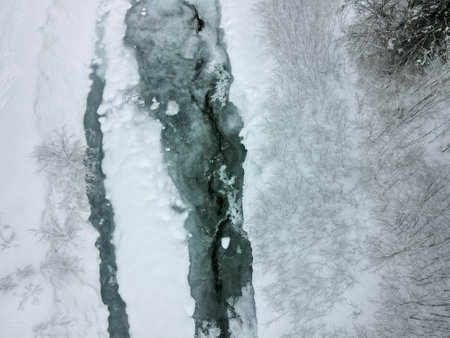 Drone view at frozen landscape at Engelberg on the Swiss alpsの写真素材