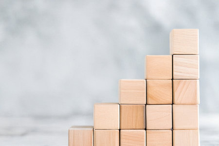 Stacked cubes representing balance, stability, and structure. Minimalist conceptual image used to...
