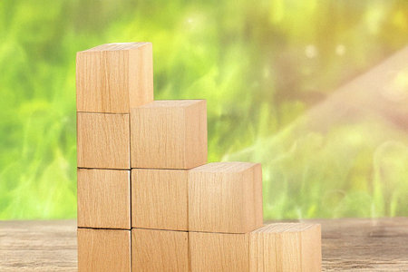 Stacked cubes representing balance, stability, and structure. Minimalist conceptual image used to...