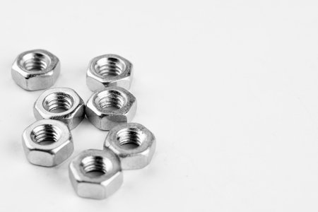 Group of screw-bolts isolated on white. Standing out of the crowd concept.
