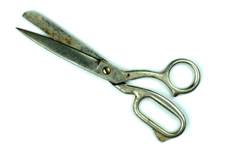 Old large scissors for cutting fabric, isolated on white background, space for advertising,