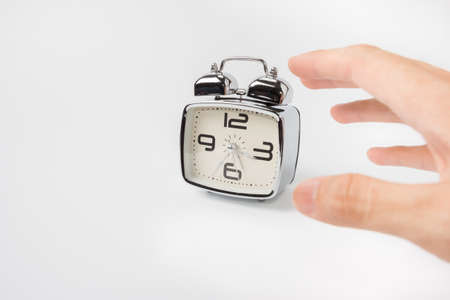 alarm clock on white background conceptの写真素材
