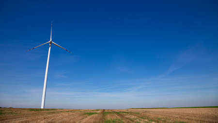 wind power plant over the deep blue sky. Sunny day, Summertime,