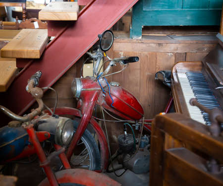 old, dusty mopeds in the pawn shopの写真素材