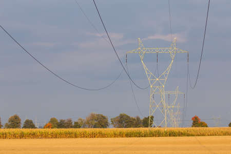 high voltage pylons against the background of blue sky