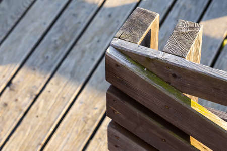 A close-up of the railing on a wooden terrace railing