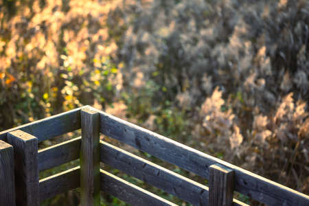 A close-up of the railing on a wooden terrace railing