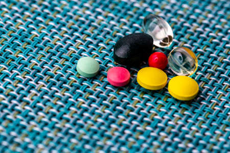 Lots of pills on the table for various illnessesの写真素材