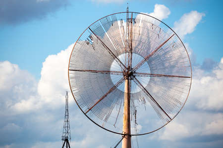 Close-up of the propeller of an old, disused wind farm. Object against the sky with tiny clouds. The...
